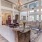 a large living room with a chandelier and a large couch