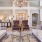 a living room with a chandelier and couches