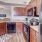 a kitchen with wooden cabinets